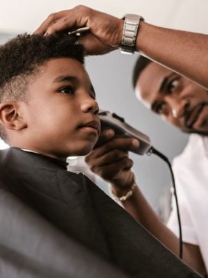 Barber Cutting Kids Hair